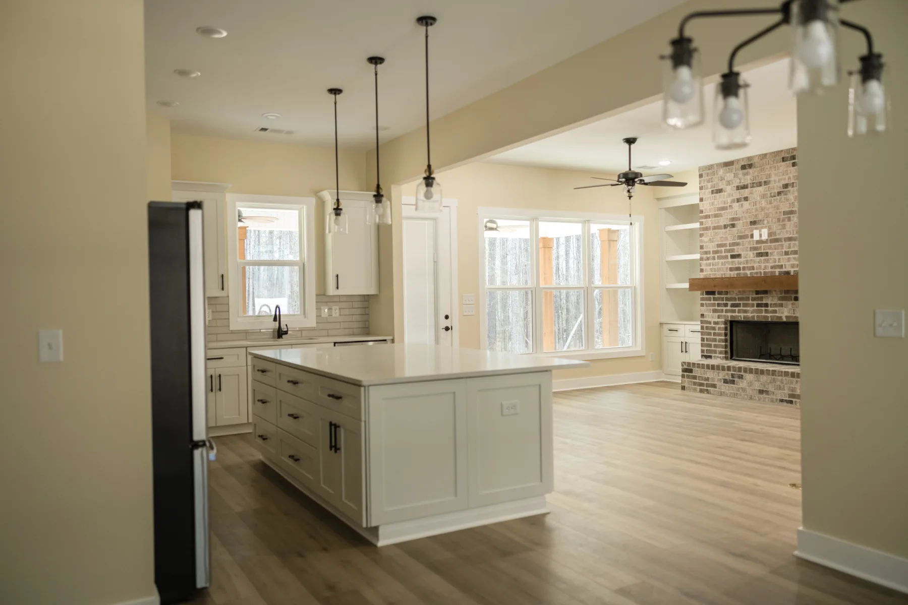 Kitchen and living space in a completed Monticello, Georgia home